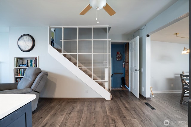 1705 36th St, Anacortes, WA 98221 - staircase with ceiling fan, wood finished floors, and baseboards