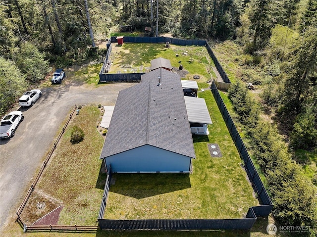 aerial view featuring a wooded view