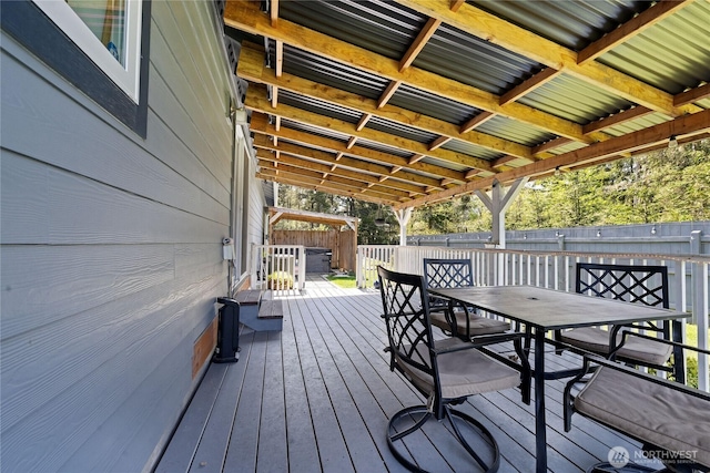 wooden deck featuring fence and outdoor dining area