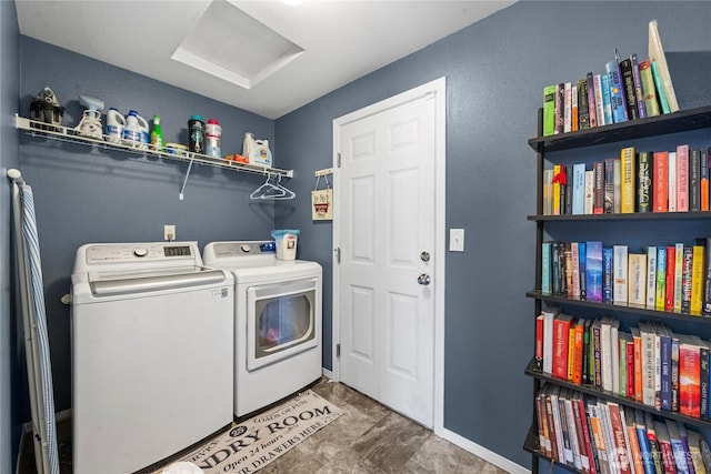 laundry area featuring independent washer and dryer, laundry area, baseboards, and attic access