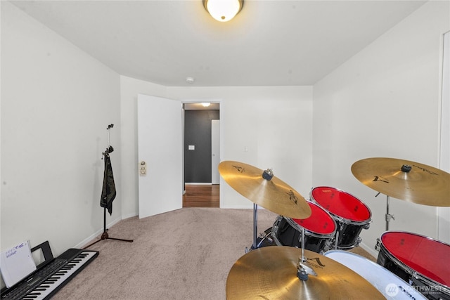 game room featuring baseboards and carpet flooring