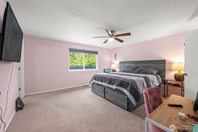 carpeted bedroom featuring baseboards and ceiling fan