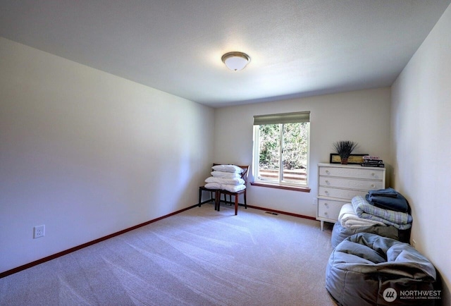 carpeted bedroom with baseboards and visible vents