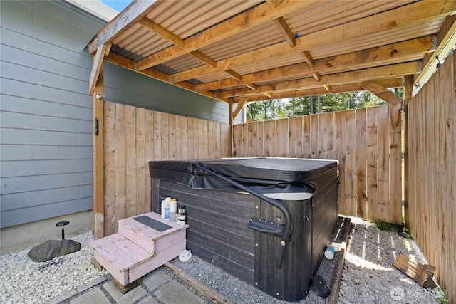 view of patio with a hot tub
