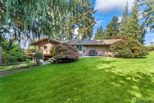 12105 SE 23rd St, Bellevue, WA 98005 - back of property with a lawn and a deck