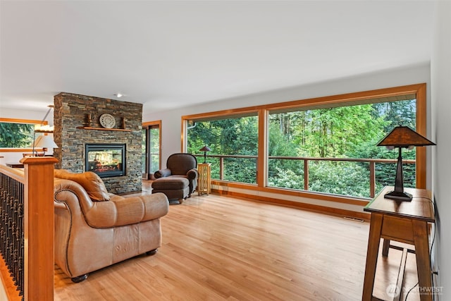 12105 SE 23rd St, Bellevue, WA 98005 - living area with light wood-style floors, a fireplace, and visible vents
