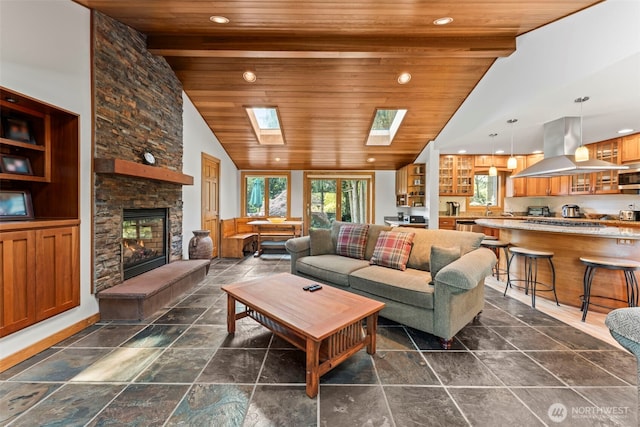 12105 SE 23rd St, Bellevue, WA 98005 - living area with vaulted ceiling with skylight, wooden ceiling, and plenty of natural light