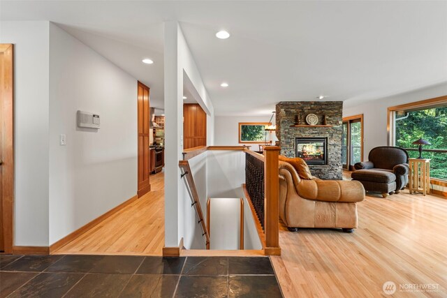 12105 SE 23rd St, Bellevue, WA 98005 - living area with plenty of natural light, a fireplace, recessed lighting, and wood finished floors