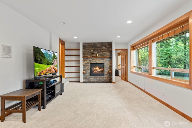 12105 SE 23rd St, Bellevue, WA 98005 - living room with recessed lighting, a stone fireplace, light carpet, and baseboards