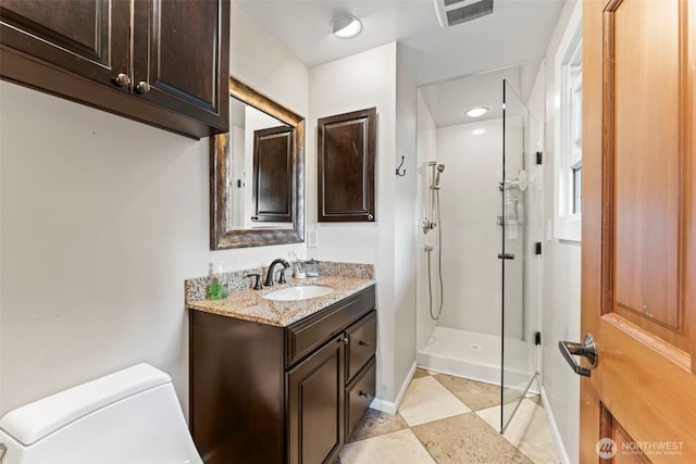 12105 SE 23rd St, Bellevue, WA 98005 - full bathroom with visible vents, walk in shower, baseboards, vanity, and toilet
