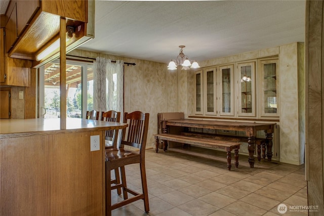 153 Biscuit Ridge Rd, Dixie, WA 99329 - dining area with light tile patterned floors and a chandelier