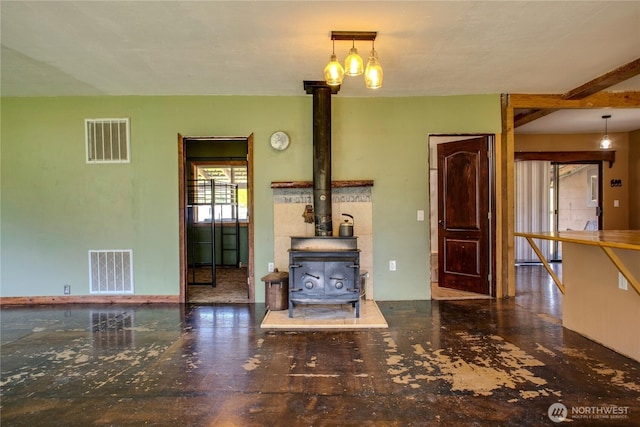 153 Biscuit Ridge Rd, Dixie, WA 99329 - unfurnished living room with a wood stove and baseboards