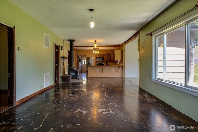 153 Biscuit Ridge Rd, Dixie, WA 99329 - unfurnished living room featuring a wood stove