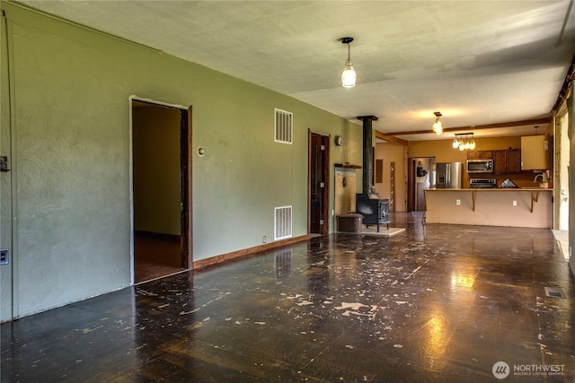 153 Biscuit Ridge Rd, Dixie, WA 99329 - unfurnished living room with a wood stove and a sink