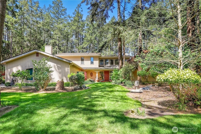 1614 Mckinnon Dr, Oak Harbor, WA 98277 - view of front facade with a chimney and a front yard