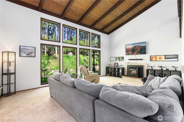 1614 Mckinnon Dr, Oak Harbor, WA 98277 - living room with high vaulted ceiling, wooden ceiling with exposed beams, light colored carpet, a fireplace, and baseboards