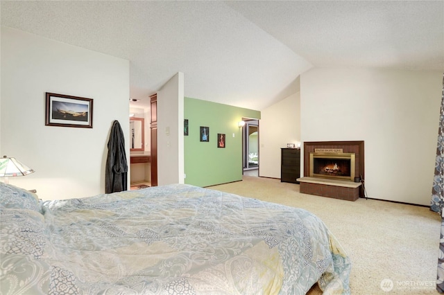 1614 Mckinnon Dr, Oak Harbor, WA 98277 - carpeted bedroom featuring lofted ceiling and a lit fireplace