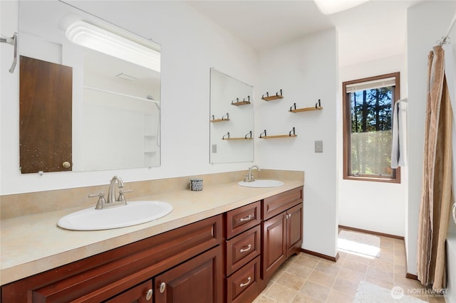 1614 Mckinnon Dr, Oak Harbor, WA 98277 - bathroom with double vanity, curtained shower, and baseboards