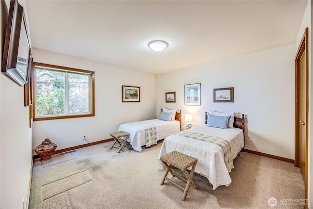 bedroom with carpet flooring, baseboards, and visible vents