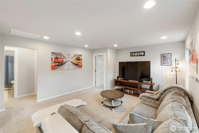 living room with visible vents, recessed lighting, and light carpet