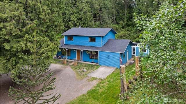 4715 NE Thunder Ln, Poulsbo, WA 98370 - traditional-style house with a porch, a shingled roof, and driveway