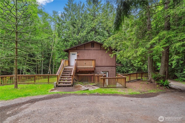 4715 NE Thunder Ln, Poulsbo, WA 98370 - view of front of property with stairway and a wooded view