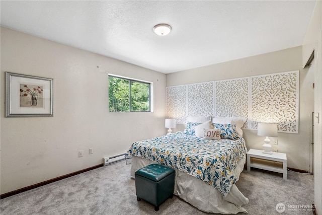 4715 NE Thunder Ln, Poulsbo, WA 98370 - bedroom with carpet flooring, a baseboard heating unit, and baseboards