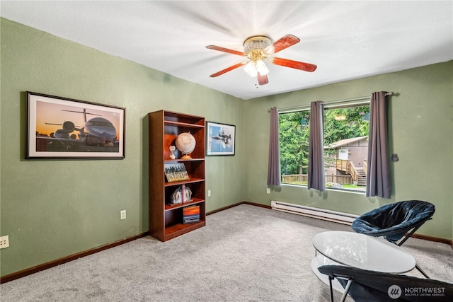 4715 NE Thunder Ln, Poulsbo, WA 98370 - living area featuring a baseboard heating unit, carpet, baseboards, and ceiling fan