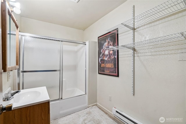 4715 NE Thunder Ln, Poulsbo, WA 98370 - full bath featuring vanity, shower / bath combination with glass door, baseboards, and baseboard heating