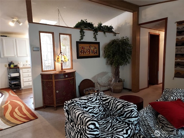 bedroom featuring light colored carpet and lofted ceiling with beams