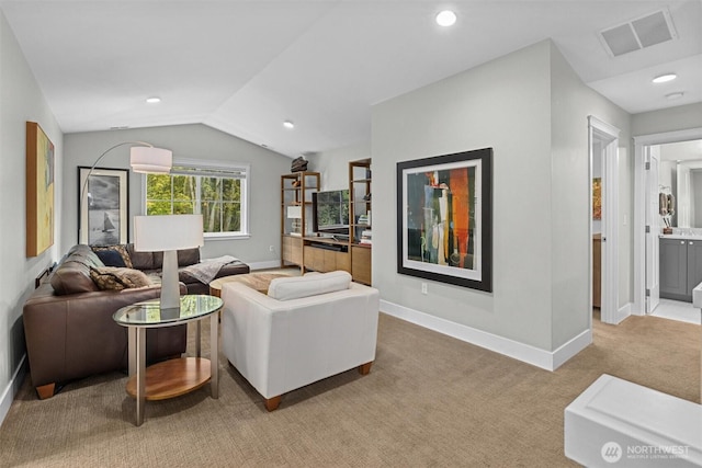 living room featuring baseboards, visible vents, light carpet, and lofted ceiling