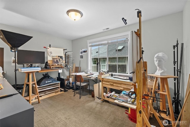 home office featuring carpet floors and visible vents