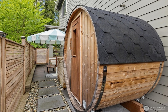 view of outbuilding featuring a fenced backyard