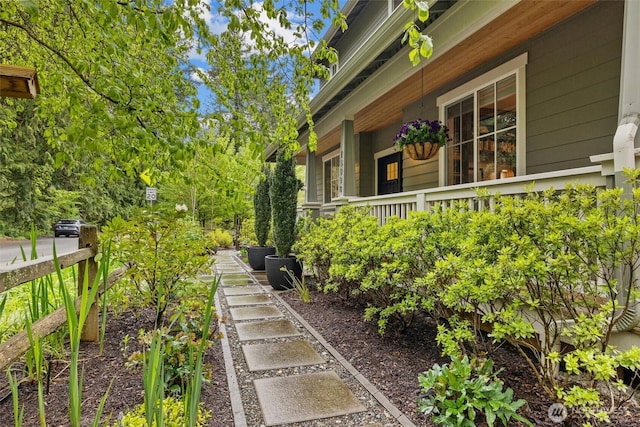 view of property exterior featuring covered porch