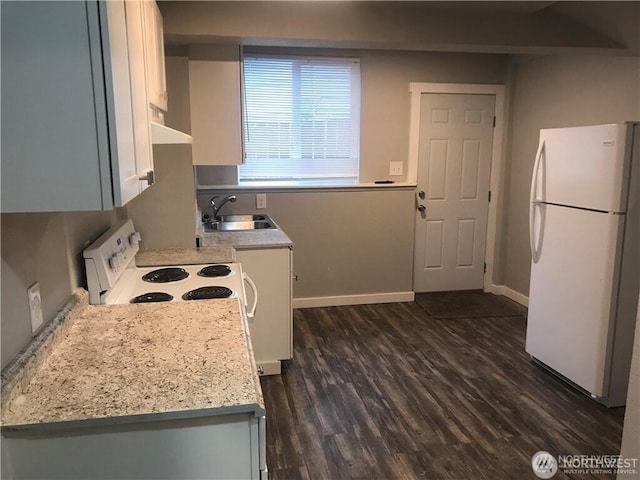 1309 Poindexter Ave Unit A-B, Bremerton, WA 98312 - kitchen with freestanding refrigerator, a sink, white cabinets, and light countertops