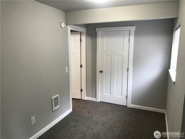 1309 Poindexter Ave Unit A-B, Bremerton, WA 98312 - unfurnished bedroom featuring dark carpet, baseboards, and heating unit