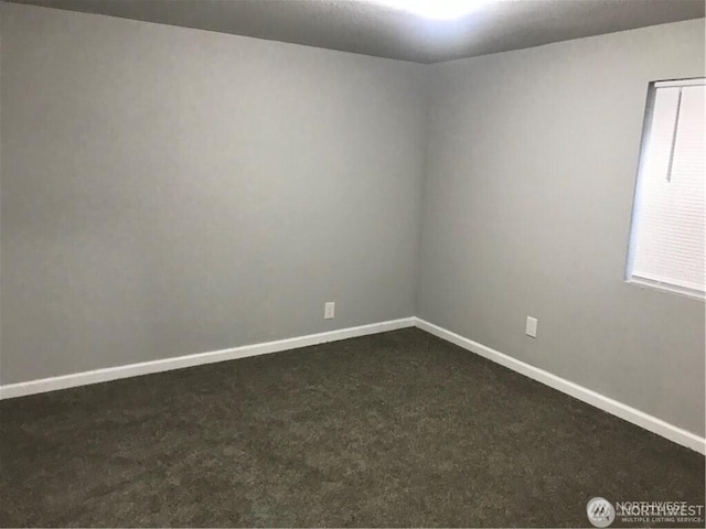 1309 Poindexter Ave Unit A-B, Bremerton, WA 98312 - empty room featuring dark carpet and baseboards
