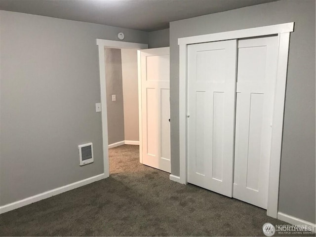 1309 Poindexter Ave Unit A-B, Bremerton, WA 98312 - unfurnished bedroom with dark colored carpet, baseboards, and a closet