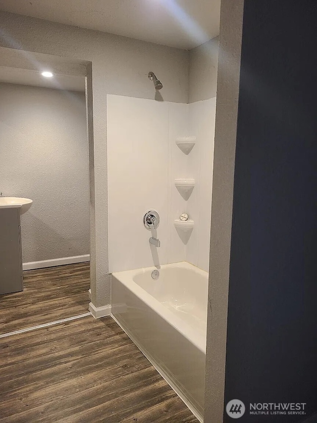 1309 Poindexter Ave Unit A-B, Bremerton, WA 98312 - bathroom with wood finished floors, baseboards, bathtub / shower combination, vanity, and a textured wall