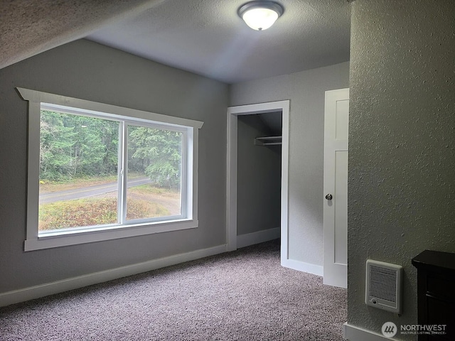 1309 Poindexter Ave Unit A-B, Bremerton, WA 98312 - unfurnished bedroom with carpet, a textured ceiling, a closet, baseboards, and heating unit