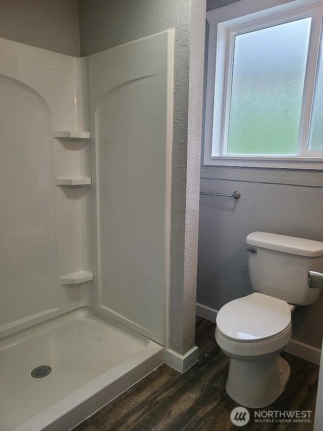 1309 Poindexter Ave Unit A-B, Bremerton, WA 98312 - bathroom with wood finished floors, baseboards, a stall shower, toilet, and a textured wall