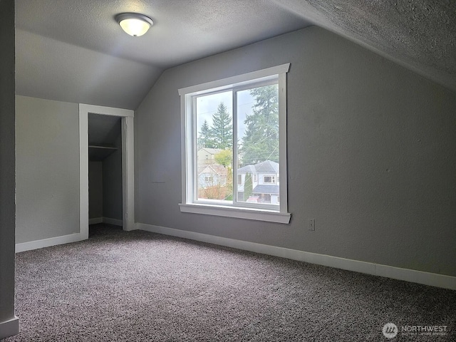1309 Poindexter Ave Unit A-B, Bremerton, WA 98312 - additional living space with lofted ceiling, carpet flooring, a textured ceiling, healthy amount of natural light, and baseboards