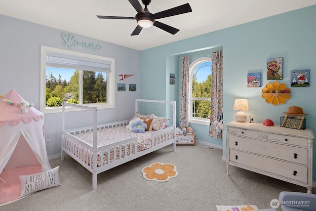 bedroom featuring baseboards, a ceiling fan, and carpet