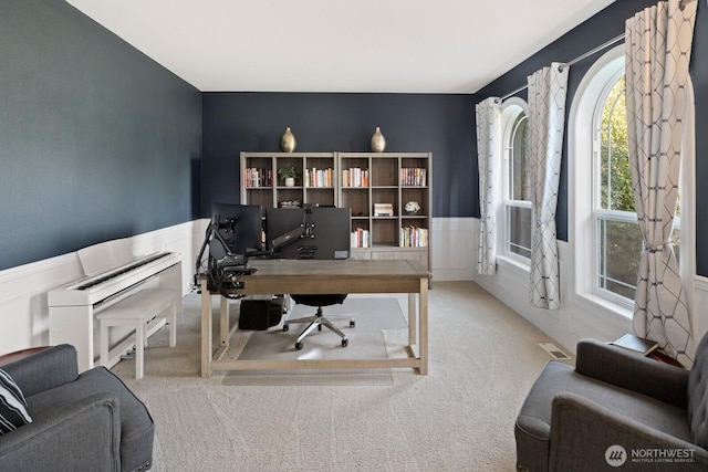 carpeted office featuring a wainscoted wall, a decorative wall, and visible vents
