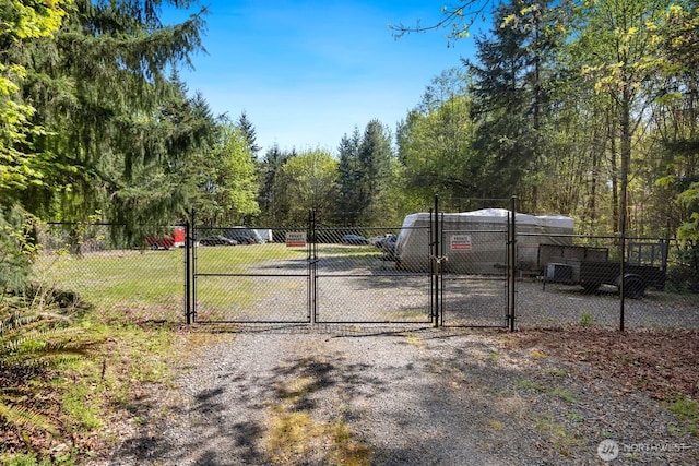 view of gate featuring fence