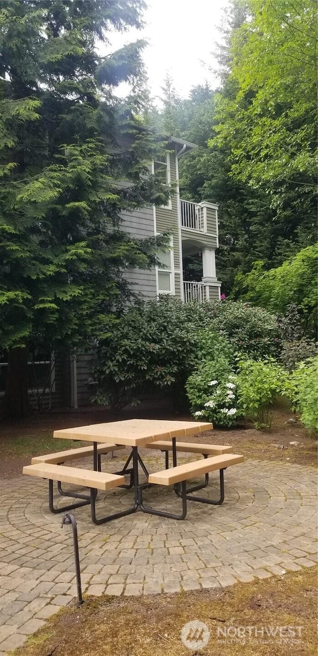 surrounding community with a patio area