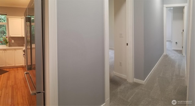 corridor featuring baseboards