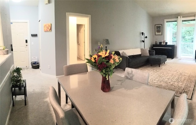 dining space featuring carpet