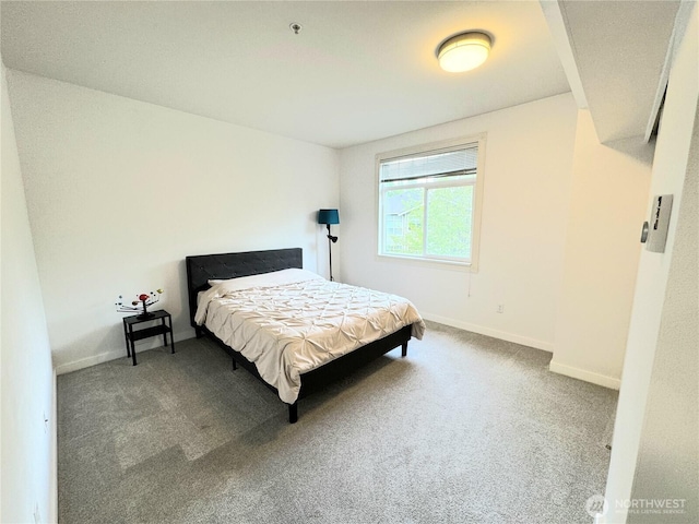 carpeted bedroom with baseboards