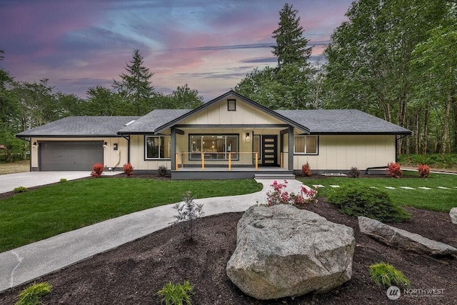 27716 114th Ave E, Graham, WA 98338 - view of front facade with a front lawn, covered porch, concrete driveway, and an attached garage